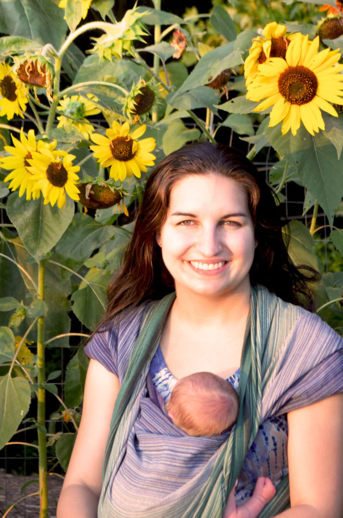 Refined Photo Editor with her son in front of sunflowers 